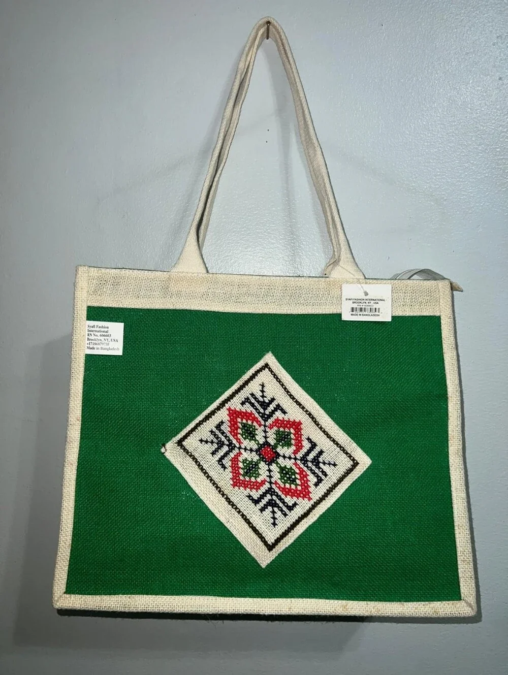 Boho-Chic Natural Jute Handbag with Cross-Stitch Embroidery.